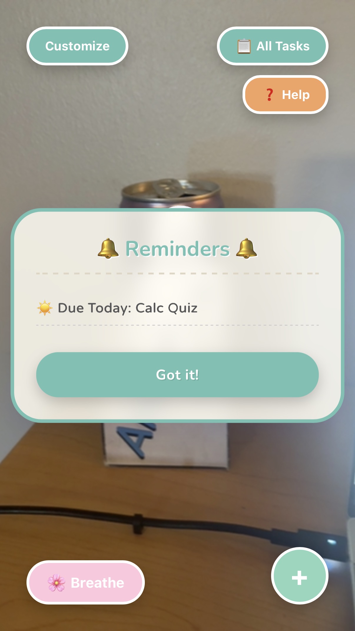 AR app over a real desk: a Reminders card reads Due Today, Calc Quiz, above a soda can.