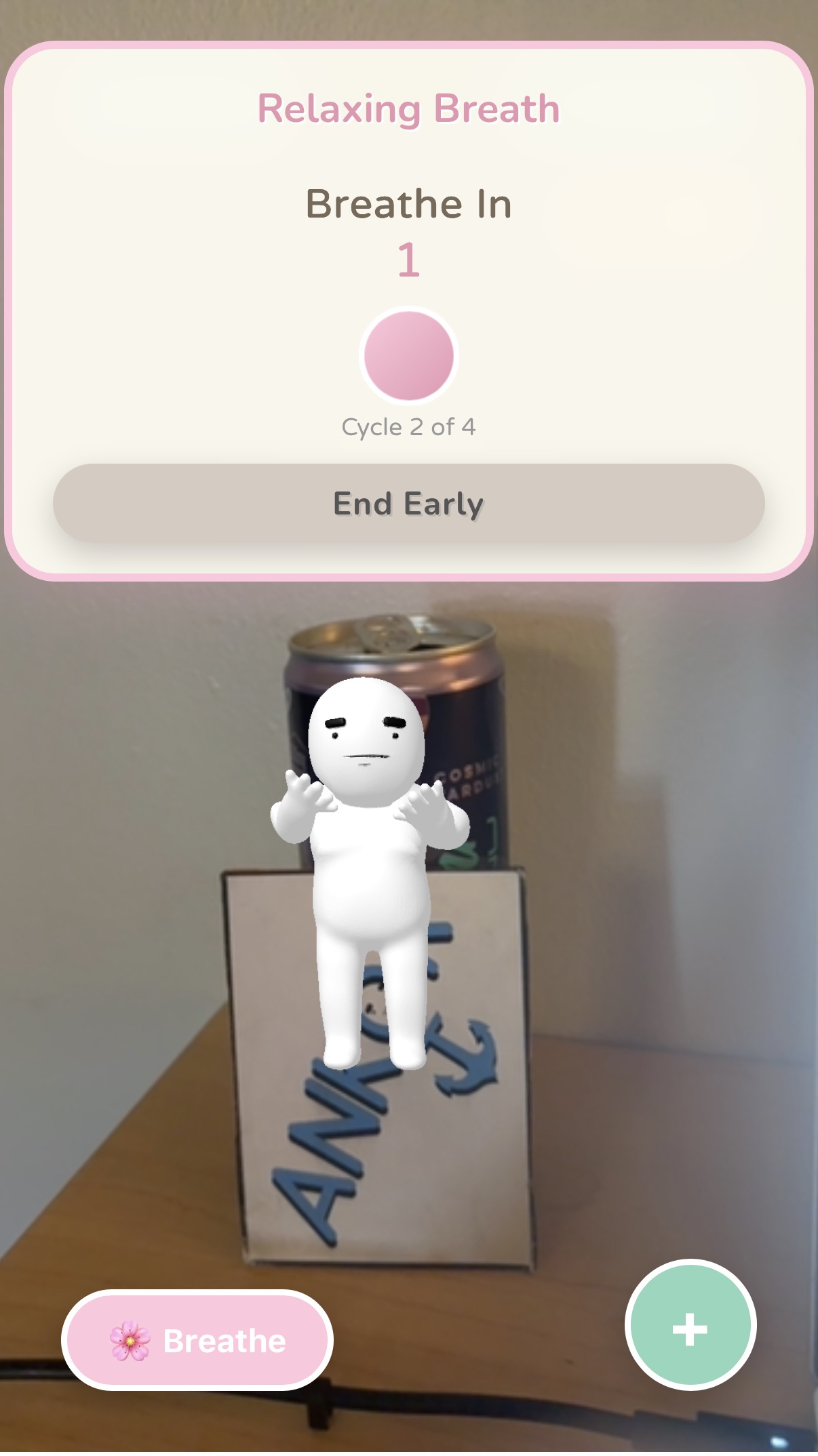 AR breathing exercise: a Breathe In counter over the white mascot standing on the Ankor box.