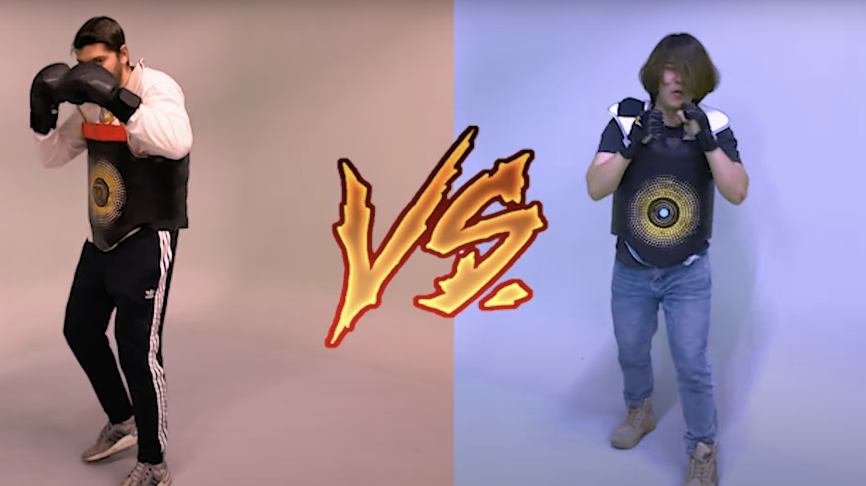 Split-screen of two people in padded chest sensors squaring up to box, with a fiery "VS." graphic.