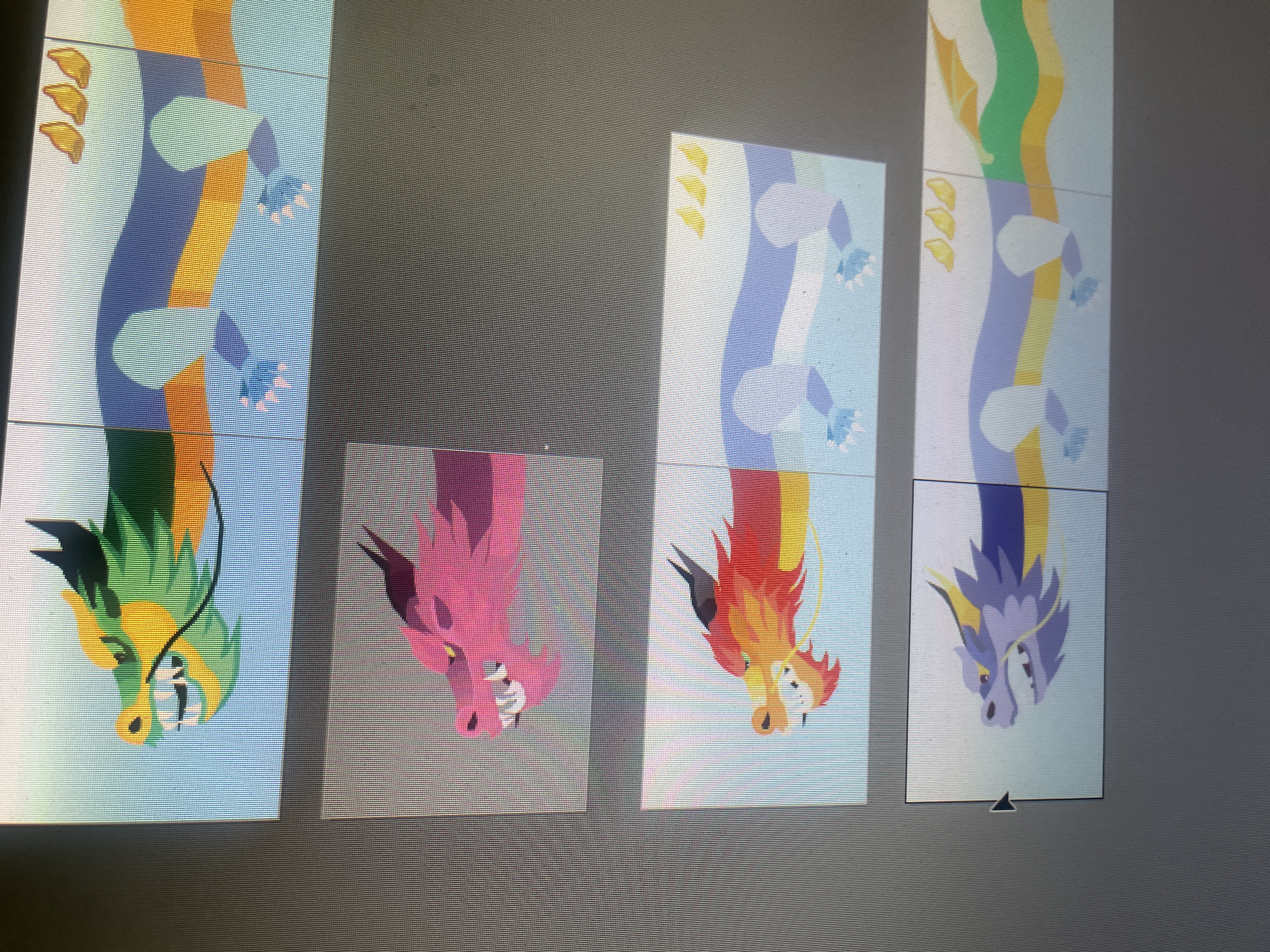 Screen showing colorful illustrated dragon card designs in green, pink, fiery red, and purple.
